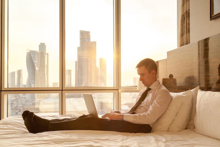 male traveller hotel room